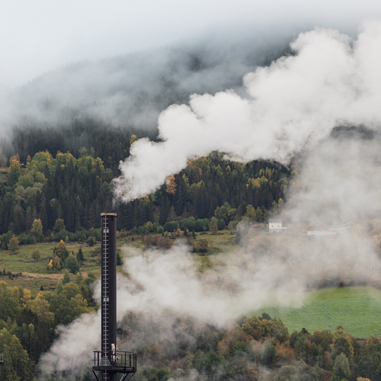 Smoke from factory chimney. Pollution and carbon capture technology concept.